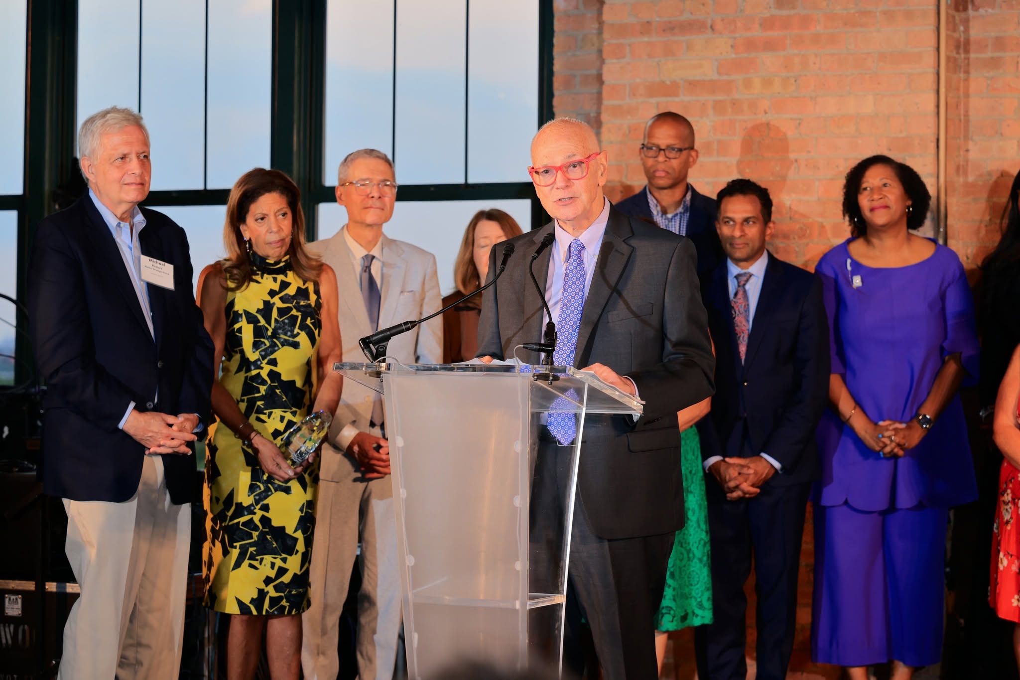 Tom Kuczmarski accepts Chicago Innovation Hall of Fame Induction with Chicago Innovation Board on stage.